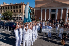 ROME, ITALY - JULY 30: The Madonna fiumarola 'river Mary' comes out of the church of Santa Maria Porto della Salute in Fiumicino, city lies on the northern side of the mouth of the Tiber River, before the procession along Rome's Tiber River as part of the traditional Festa di Noantri on July 30, 2017 in Rome, Italy. The feast was instituted in 1927, but its origin dates back to the 16th century. In 1535, after a violent thunderstorm, a statue of Mary carved out of cedar wood washed up on the shores of the Tiber. She was brought up the river and given to the then Carmelite church of St. Chrysogonus. (Photo by Stefano Montesi - Corbis/Corbis via Getty Images)