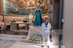 ROME, ITALY - JULY 30: The Madonna fiumarola 'river Mary' in the church of Santa Maria Porto della Salute in Fiumicino, city t lies on the northern side of the mouth of the Tiber River, before the procession along Rome's Tiber River as part of the traditional Festa di Noantrion July 30, 2017 in Rome, Italy. The feast was instituted in 1927, but its origin dates back to the 16th century. In 1535, after a violent thunderstorm, a statue of Mary carved out of cedar wood washed up on the shores of the Tiber. She was brought up the river and given to the then Carmelite church of St. Chrysogonus. (Photo by Stefano Montesi - Corbis/Corbis via Getty Images)